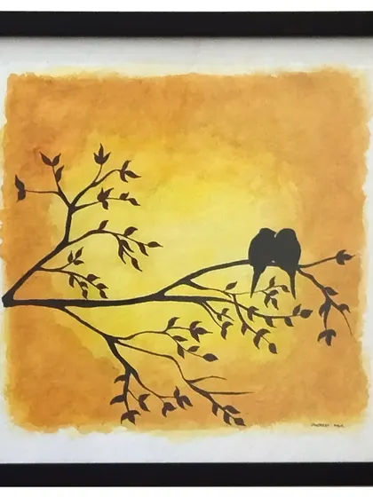 A simple silhouette can tell a powerful story. Here, two love birds sit on a branch against a warm, blended watercolor sunset. It’s a quiet, romantic moment captured in a 10x10 inch frame, perfect for celebrating love.