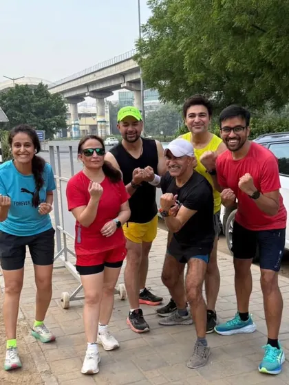 The tribe posing after a tough session. The metro bridge in the background is a reminder that we train in the heart of the city, before it wakes up.