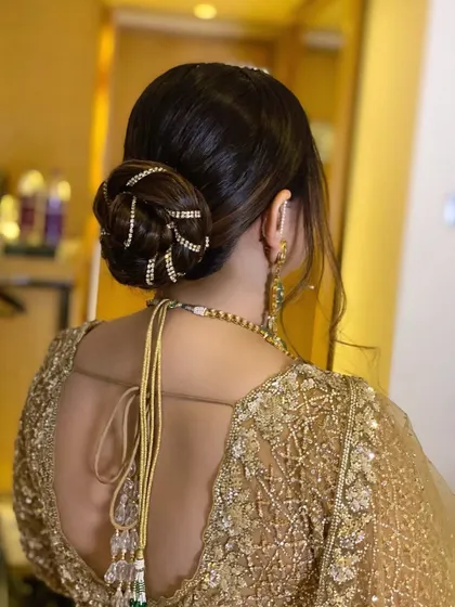 This elegant, sequenced roped knot bun is perfect for a traditional event. The intricate design is made possible by the extra volume provided by my hair extensions.