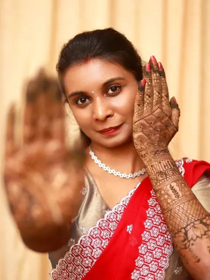A duplicate of 105, but still a great image. A creative pose from a happy client, showcasing her intricate bridal mehndi. I love when my clients have fun and feel beautiful with their henna.