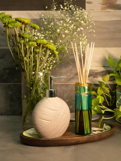 The Ginza Reed Diffuser, defined by its striking color combinations and hand-cut glass vessel. It's a simple, elegant, and luxurious scenting solution for your home.
