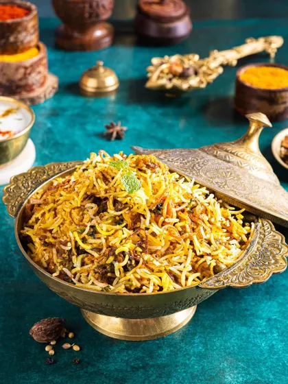A majestic bowl of biryani, styled in traditional brassware. I used spices and herbs as props to tell the story of the dish's rich flavours and aromatic ingredients.