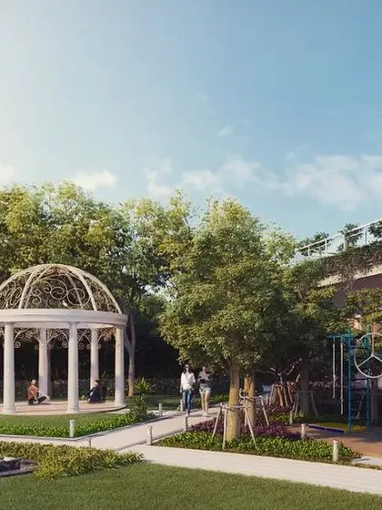 The central green of a housing project in Ranchi, designed as a community hub. The space is equipped with an outdoor gym, a kids' play area, a yoga pavilion, and a water feature, providing amenities for all age groups.