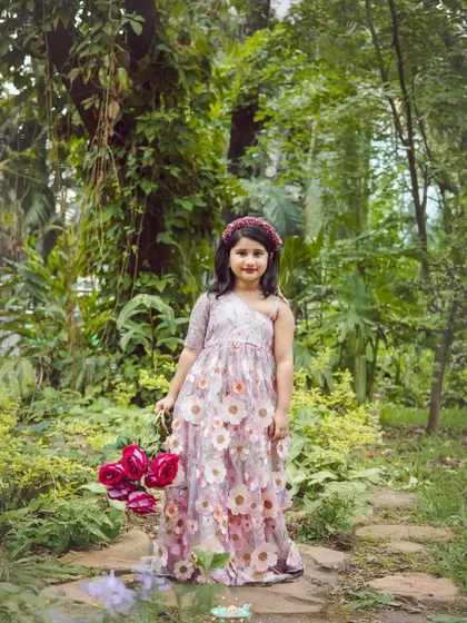 This little flower child looks right at home in the garden. Outdoor sessions allow us to capture beautiful, candid moments in a relaxed setting.