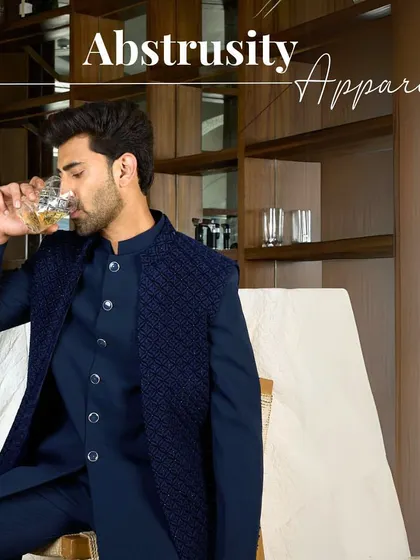 Abstrusity Apparel. A relaxed moment in the navy Indo-Western set, showcasing its blend of modern style and traditional flair.