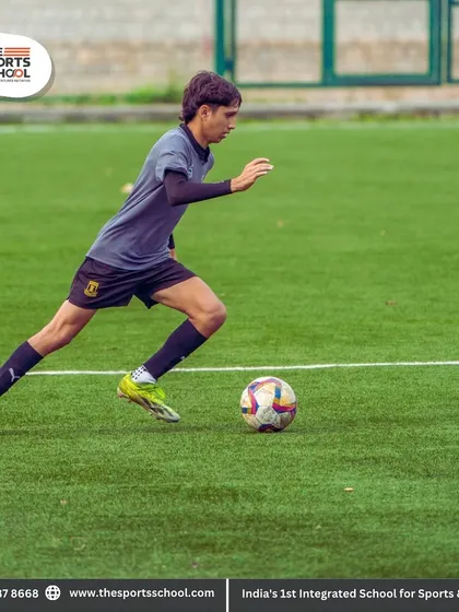 A player dribbles at speed, showcasing the combination of pace and technical skill that we aim to develop.