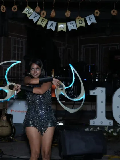 Another shot from the Shadowfax anniversary, posing with my LED fans in front of the "10 Years" sign.