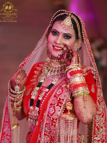 A classic bridal portrait capturing a shy, happy smile. We aim to capture the mix of emotions a bride feels on her wedding day, from excitement to joyful coyness.