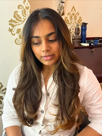 Curtain bangs and soft layers for Fida.