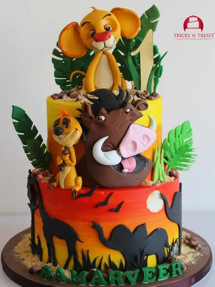 Hakuna Matata! This Lion King themed cake is so vibrant and fun, featuring hand painted sunset tiers and adorable fondant figures of Simba, Timon, and Pumbaa. It's a perfect centerpiece for a jungle themed party.