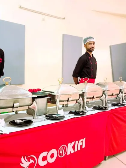 A close-up of our staff and the buffet line, highlighting the readiness and professionalism of our team.