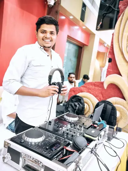 Ready to get the party started at a wedding reception. A professional setup and a deep understanding of music are key, but my real job is to read the crowd and create a vibe that makes your special day unforgettable.