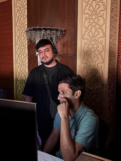 Our team members focused on their tasks at the technical console. Teamwork is essential for a smooth execution.