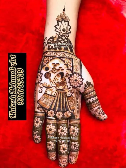 A single-hand Karwa Chauth design featuring a woman with a 'thali' and sieve. This is a great option for those who want a beautiful and thematic design that is not too heavy.