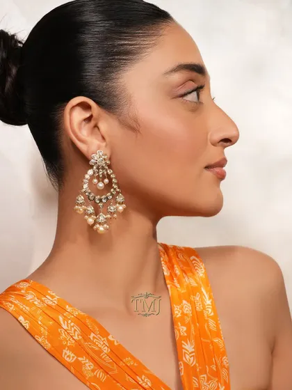A festive look is incomplete without the sparkle of chandbaalis. These exquisite pearl and polki earrings from my Noor collection are a timeless choice for any celebration.