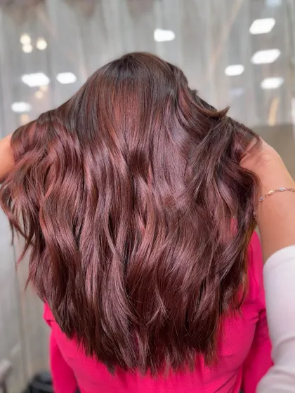 The back view of this dimensional brown, showing the depth and richness of the color through soft waves.