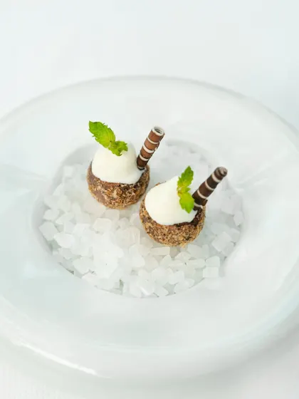 A dessert crafted by Chef Shantanu Mehrotra as part of our tasting menu. These bites of tender coconut and dark chocolate are a study in balance, both light and indulgent.