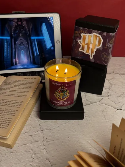 Let the magic decide your Hogwarts house. This Harry Potter themed candle reveals your house color as it burns. Which one will it be?