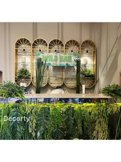 The 'Wild Bar' setup, showcasing the attention to detail in the greenery and props.