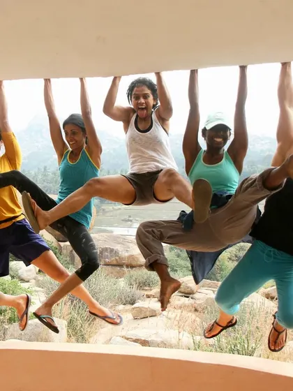 Just hanging out! This playful shot of our crew hanging from a ledge perfectly captures the fun, silly, and strong spirit of our community.