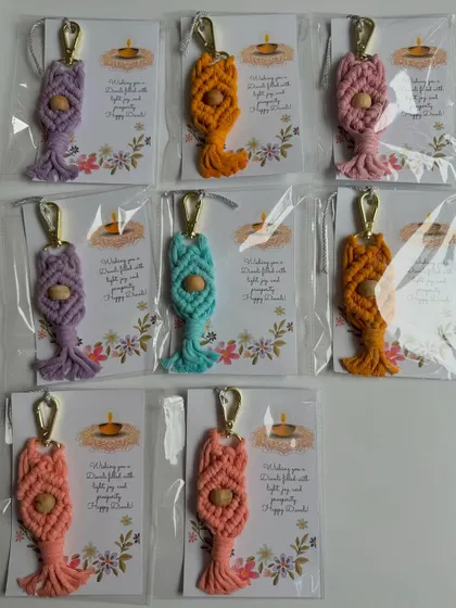 An assortment of my custom Diwali keychains, each individually wrapped. This shows how I prepare bulk orders to make your gifting process as easy as possible.