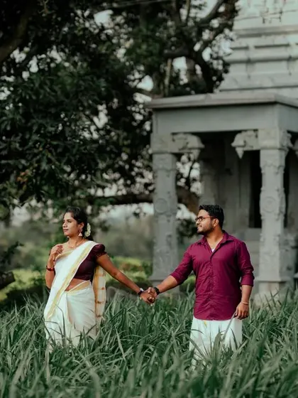 A duplicate of ID 112, showcasing a couple's connection amidst a natural landscape with a touch of architectural history.