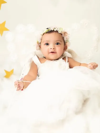 With angel wings and a starry background, this little one looks like she came straight from heaven. It's a beautiful theme for capturing innocence.
