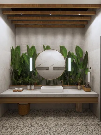 A boho-inspired bathroom concept designed to feel earthy and connected to nature. The space features a patterned tile floor, a wood-block vanity, and plenty of indoor plants.