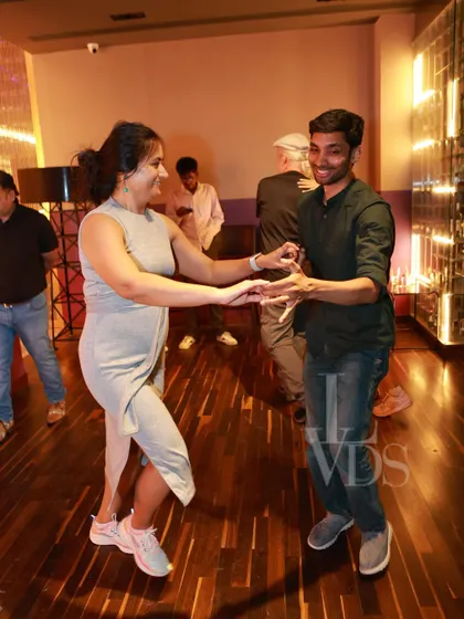 A happy couple enjoying a dance during our Women's Day celebration. The atmosphere was full of joy and appreciation.