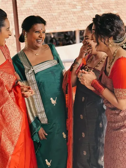A candid moment with my girls. We are all wearing different styles, but we share a love for dressing up and celebrating together. I'm wearing a custom Coorgi-style draped saree.
