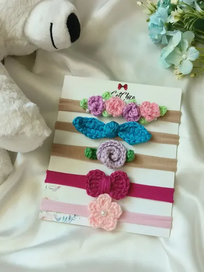 This set of five floral newborn headbands offers a beautiful variety of styles and colors for baby photography.
