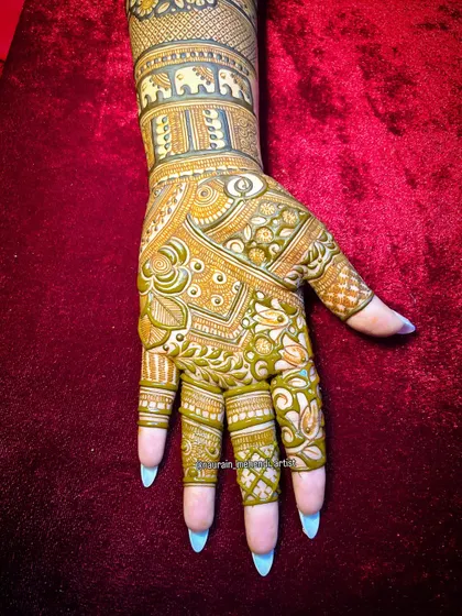 A clear shot of a freshly applied design. This shows the consistency and color of the wet henna paste, and how clean lines are essential for a professional result.