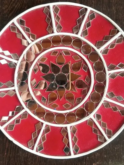 Another view of the geometric red Lippan art piece. This traditional Indian art form is perfect for creating unique home decor, and I guide you through every step of the process.