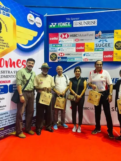 With guests and dignitaries at the final day presentation of the state badminton tournament.