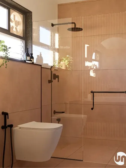 For this renovation, the client's brief was "I want mud in my bathroom." We interpreted that as a desire for a cozy, earthy feel. We used warm, terracotta-colored tiles and black fixtures to create a space that feels grounded, warm, and deeply comforting.