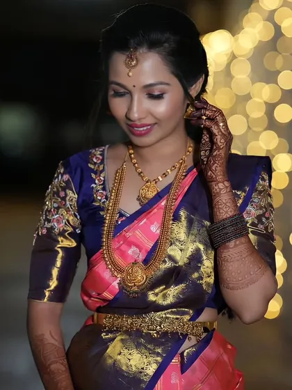 A reception look with beautiful bokeh lighting. The makeup is designed to look stunning in all lighting conditions, especially for evening events.