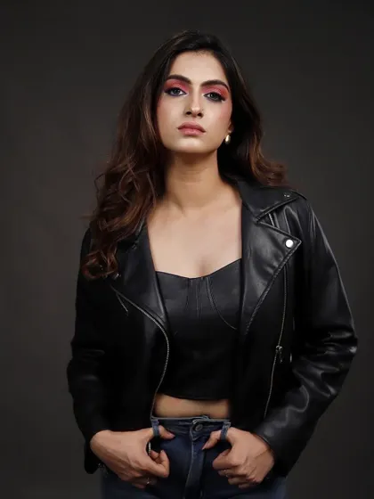 A direct, front-facing shot in a leather jacket. This is a powerful headshot that casting directors appreciate for its clarity and the confidence it projects.
