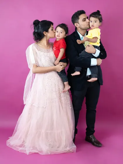 A beautiful family portrait with their twin boys. We have experience working with twins to capture both their individual personalities and their special bond.