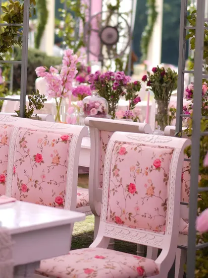 The dining chairs featured beautiful floral-print upholstery, perfectly matching the romantic, pastel-pink theme of the lunch.