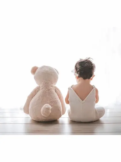 Two best friends looking out at the world together. This simple, poignant shot of a baby and a teddy bear is one of my favorites for its storytelling quality.