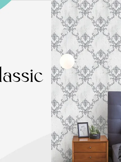 This classic damask wallpaper is a perfect choice for a sophisticated bedroom. The grey and white color palette offers a modern take on a traditional design, creating a look that is both timeless and elegant.
