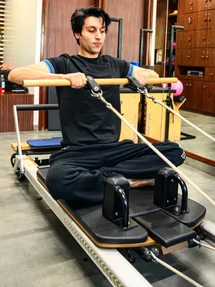 A client works on his upper body strength using the reformer. We believe in making movement a daily habit to build a stronger, more energized body.