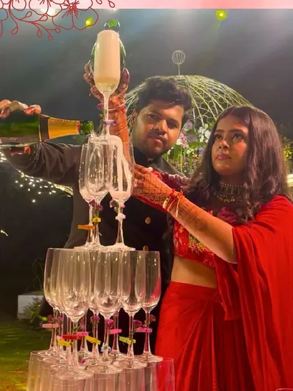 The classic champagne tower, a symbol of celebration. We love helping couples create this iconic moment at their reception, as seen here at Saltt, Karjat.