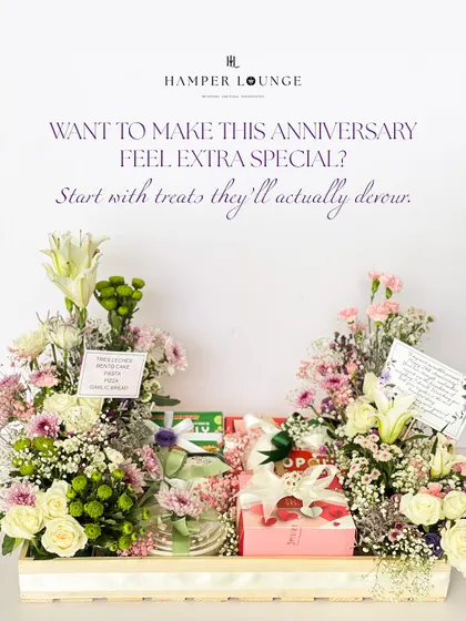 Want to make this anniversary extra special? This hamper is filled with treats they'll actually devour, surrounded by two beautiful floral arrangements, making it a celebration of love and indulgence.