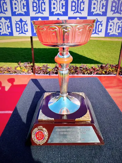 The Vidhana Soudha Trophy, a classic silver bowl with an ornate base.