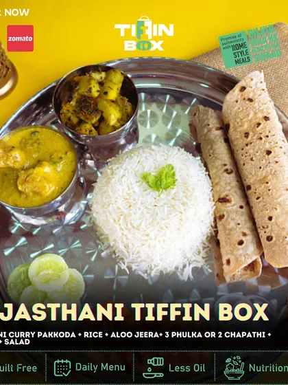 Take a trip to Rajasthan with our Rajasthani Tiffin Box. This special meal includes Rajasthani curry pakkoda, aloo jeera, dal fry, rice, and salad. It's a unique and authentic taste you won't find everywhere.