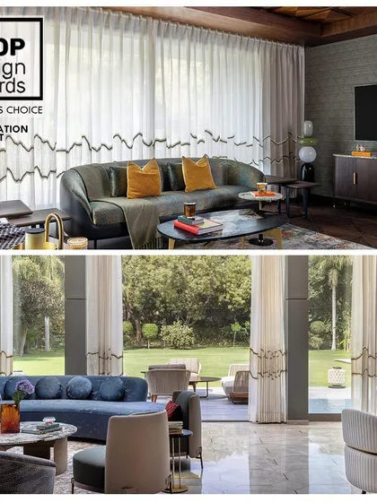 This award-winning renovation project, recognized by the Loop Design Awards, transforms a dated space into a modern haven. The custom embroidered curtains add a unique, flowing design element that connects the room to the nature outside.