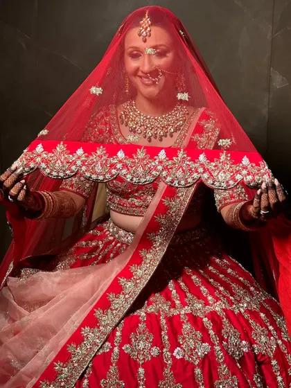 A classic shot with the veil. The makeup is soft yet defined, creating a mysterious and romantic look.