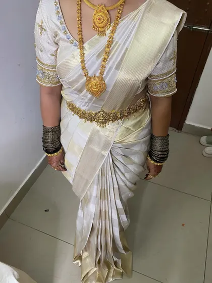 The beauty of a Kanjivaram saree is in its pleats. Here, I've focused on creating clean, sharp, and perfectly aligned pleats that give the saree a graceful fall and ensure it stays immaculate throughout the day's events.