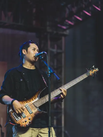 Our bassist holding down the low end and providing backing vocals during a festival performance.